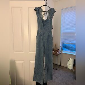 Blue Denim open-back Jumpsuit with Ruffles